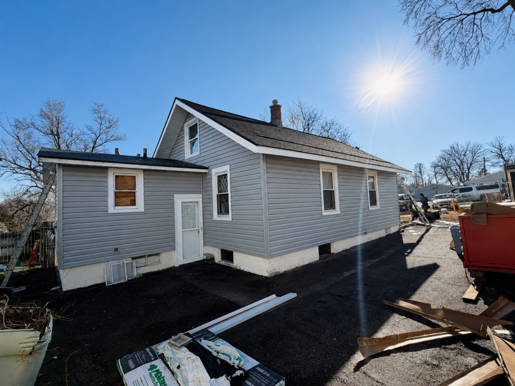 Storm damage claim replacement home with new vinyl siding installed by KO Roofing & Storm Repair in Bellevue, NE
