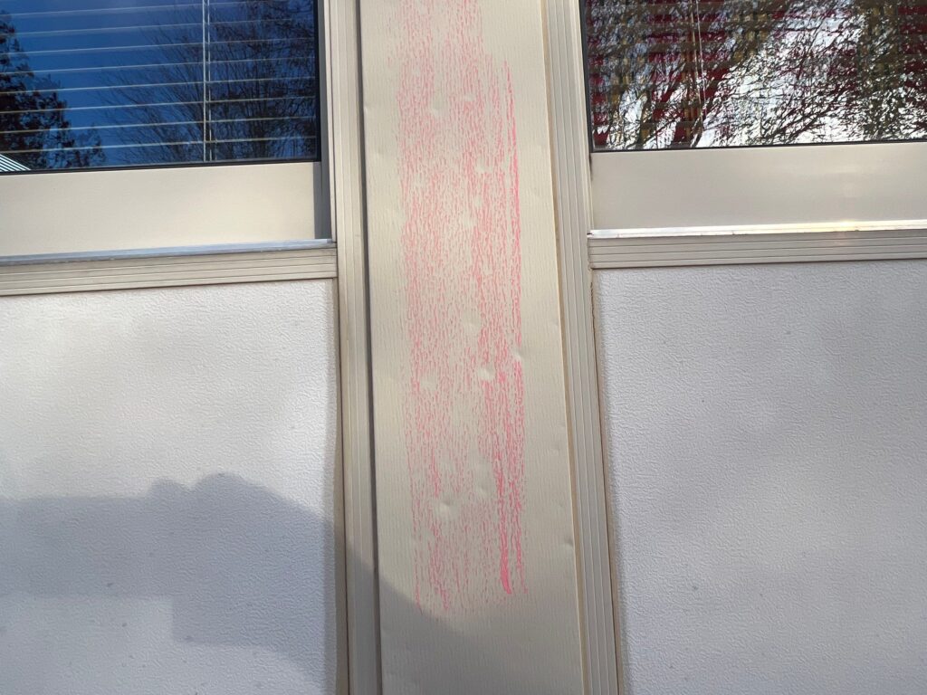 Window Wraps with chalk-marked hail damage on soft metal.